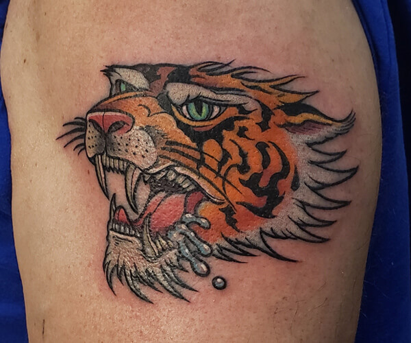Newly renovated tiger face tattoo