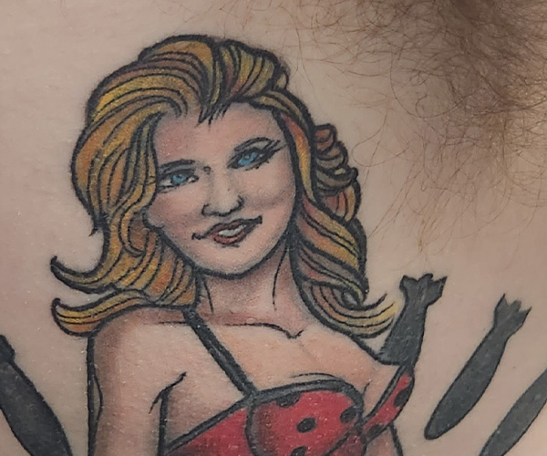 Wife Pinup tattoo after renovation at iFixTattoos