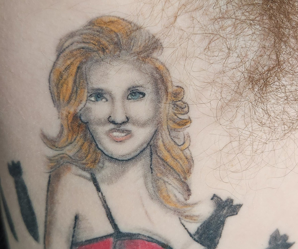 Pinup tattoo before being reworked at iFixTattoos