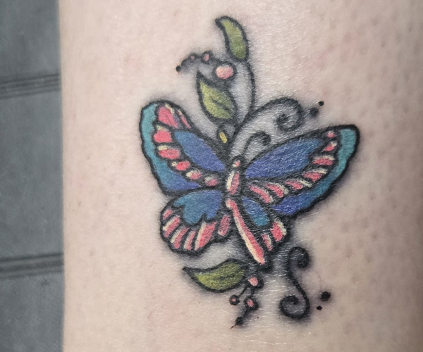 after restoration of faded butterfly tattoo